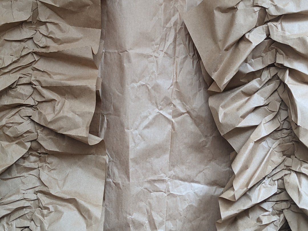 Close-up of recycled nylon trench coat with technical details and water-resistant finish