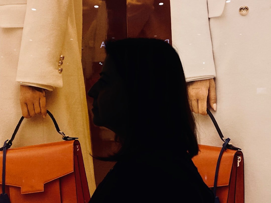 Split image showing woman wearing oversized tan blazer on left and cropped black jacket on right, street style photography